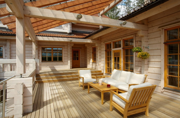 conception d'une maison en rondins avec une terrasse