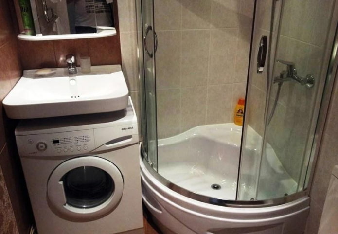 cabine de douche et machine sous le lavabo