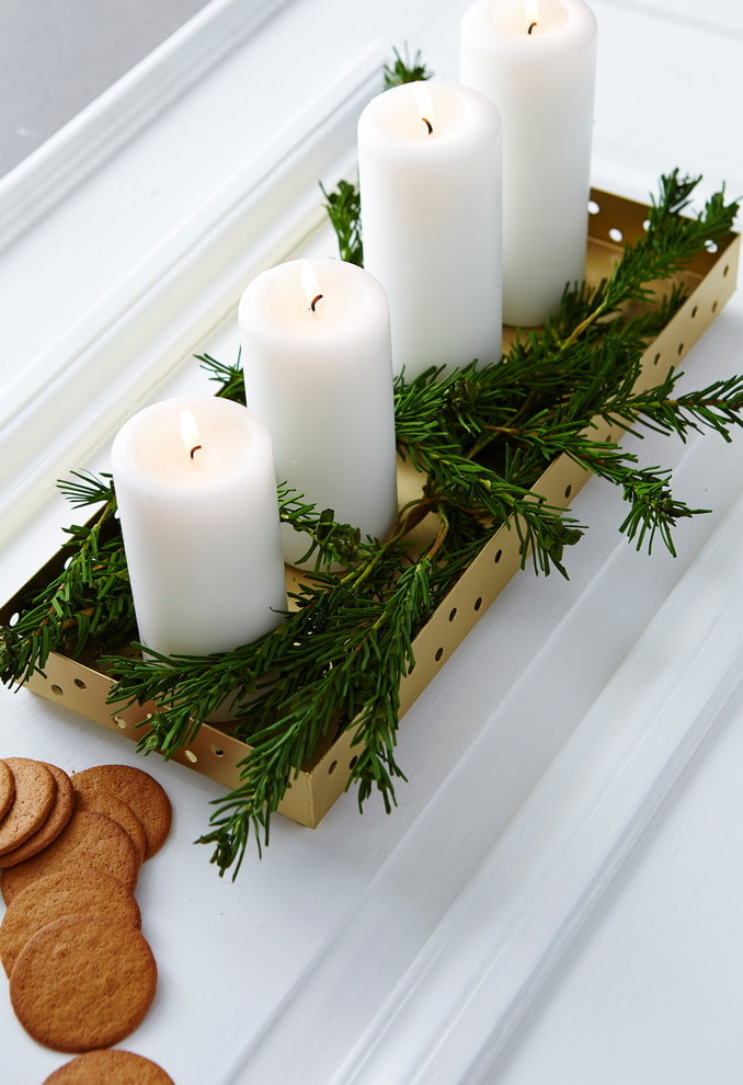 Bougies aux branches de sapin